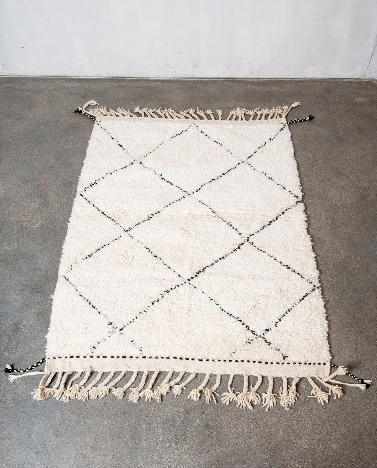 Modern, designer, handcrafted Berber rug from Morocco. Beniourain carpet with minimalist design, natural wool pile and a fluffy texture.